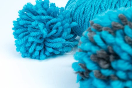 Photo for Skein of blue threads for knitting on a white background. pompon. fluffy soft pompon made of yarn - Royalty Free Image