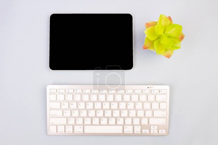Photo for Tablet, calculator, phone, pen and a cup of coffee, lot of things on a light background. Top view with copy space - Royalty Free Image