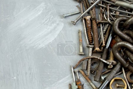 Photo for Nuts, washers, bolts, screws of various sizes and shapes over the plain background. A set for the mechanic - Royalty Free Image