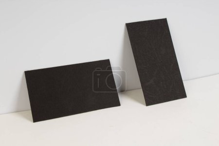 Photo for Blank Black business cards on the white background. Template for ID - Royalty Free Image