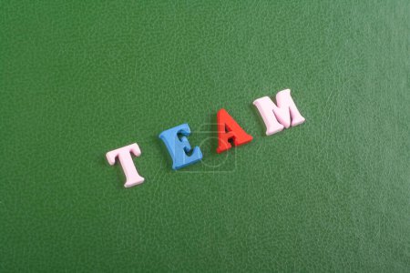 Photo for TEAM word on green background composed from colorful abc alphabet block wooden letters, copy space for ad text. Learning english concept - Royalty Free Image