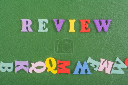 Photo for REVENUE word on green background composed from colorful abc alphabet block wooden letters, copy space for ad text. Learning english concept - Royalty Free Image