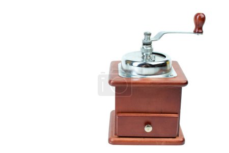 Photo for Hand coffee grinder isolated on brown background. Front view - Royalty Free Image