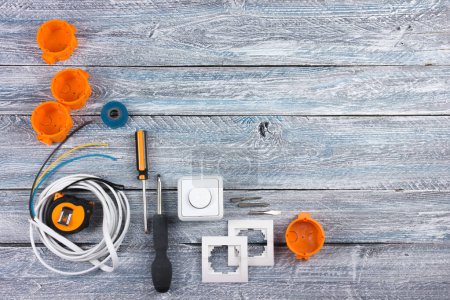 Photo for Professional repairing implements for decorating and building renovation set in the wooden background. Top view - Royalty Free Image