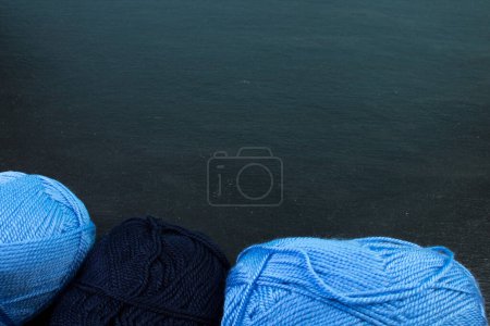 Foto de Knitting yarn for knitting on black background - Imagen libre de derechos