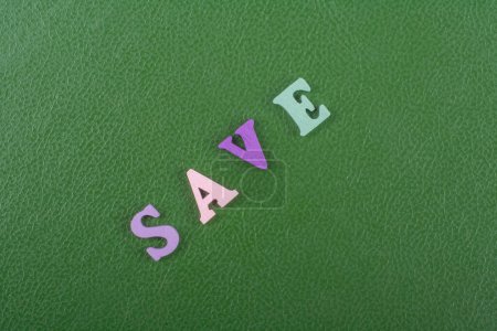 word on green background composed from colorful abc alphabet block wooden letters, copy space for ad text. Learning english concept