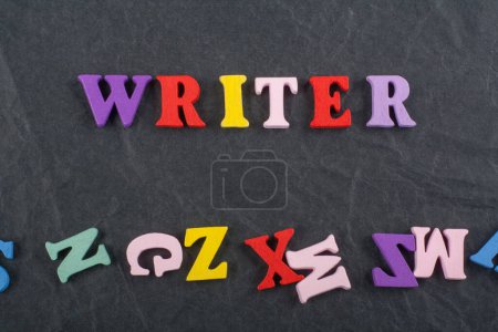 word on on black board background composed from colorful abc alphabet block wooden letters, copy space for ad text. Learning english concept.
