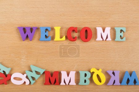 word on wooden background composed from colorful abc alphabet block wooden letters, copy space for ad text. Learning english concept
