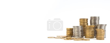 Photo for Gold towers made out of gold and silvery coins, stack isolated on white. Banner - Royalty Free Image