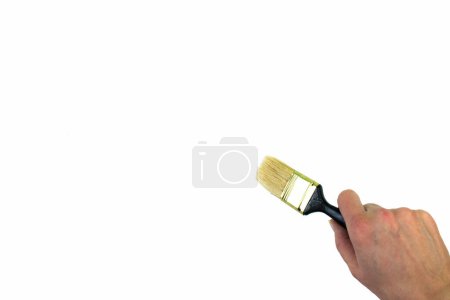 Photo for Hand holding painting brush on white background - Royalty Free Image