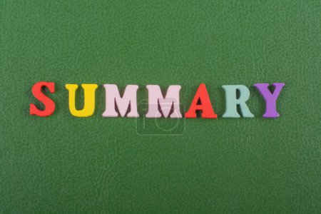 SUMMARY word on green background composed from colorful abc alphabet block wooden letters, copy space for ad text. Learning english concept