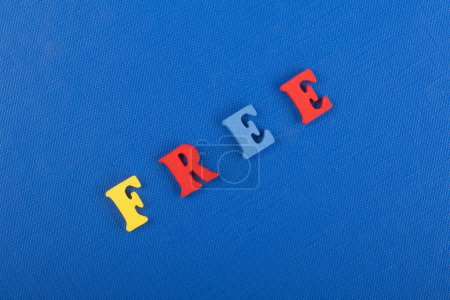 word on blue background composed from colorful abc alphabet block wooden letters, copy space for ad text. Learning english concept