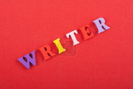 word on red background composed from colorful abc alphabet block wooden letters, copy space for ad text. Learning english concept.