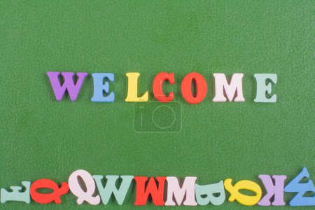 word on green background composed from colorful abc alphabet block wooden letters, copy space for ad text. Learning english concept