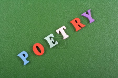 POETRY word on green background composed from colorful abc alphabet block wooden letters, copy space for ad text. Learning english concept