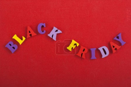 Word on red background composed from colorful abc alphabet block wooden letters, copy space for ad text. Learning english concept