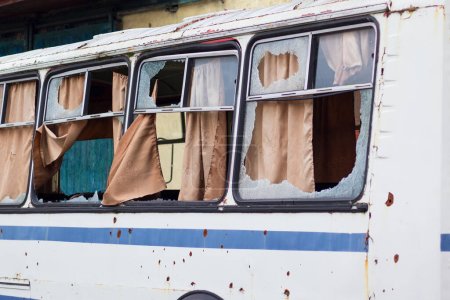 Broken, shelled, broken bus windows during the war.
