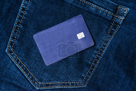 Photo for Bank card on a dark denim background. Credit shopping concept. - Royalty Free Image