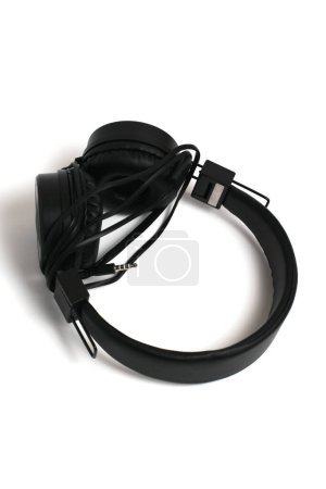 Photo for Black headphones on a white background. Cheap headphones for listening to music. - Royalty Free Image