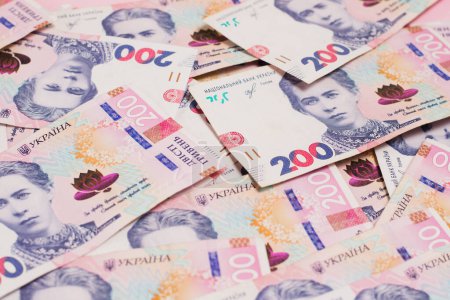 Money background, many bills close-up. Many Ukrainian hryvnias close-up.