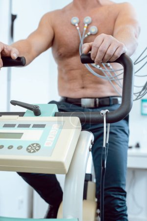 Photo for Patient during exercise ECG on stationary bike - Royalty Free Image