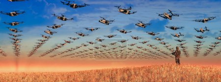 Photo for A singular soldier oversees a massive deployment of military drones against the warm backdrop of a setting sun. - Royalty Free Image