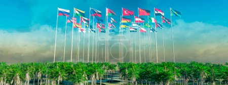 Colorful national flags fluttering high amidst tropical palm trees under a soft blue sky with wispy clouds.