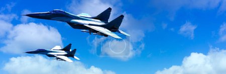 Photo for Two military fighter jets in flight, captured against the vibrant backdrop of a cloud-dotted blue sky, showcasing aerial prowess. - Royalty Free Image