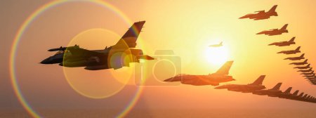 Silhouetted jet planes in V-formation against a vivid sunset sky, with lens flare.
