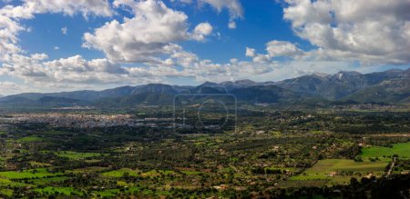 Photo for Expansive view of Inca city set against the green valleys and mountainous backdrop of Mallorca - Royalty Free Image