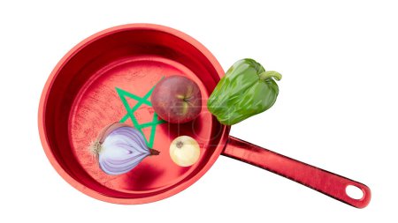 Mélange créatif d'éléments culinaires, les légumes frais reposent sur une poêle rouge ornée du pentagramme vert symbolisant le Maroc..