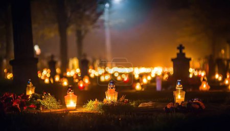 Photo for Cemetery at night with lit candles, light fog - Royalty Free Image