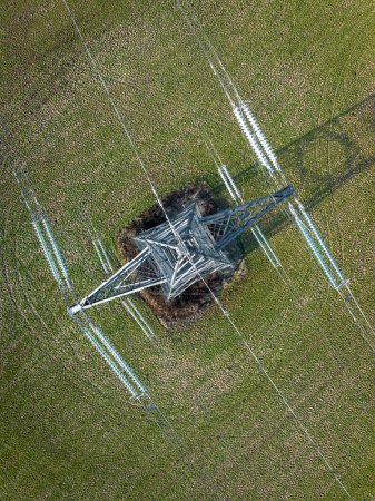 Photo for Bird's Eye View of Industrial High Voltage Lattice Power Line Tower - Royalty Free Image