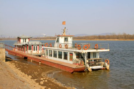 Photo for LUAN COUNTY - MARCH 9: Cruise ships in the luanhe river scenic area, on march 9, 2014, Luan county, hebei province, China. - Royalty Free Image