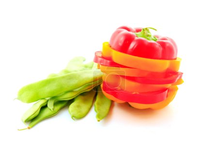 Foto de Chopped color pepper and beans on white background - Imagen libre de derechos