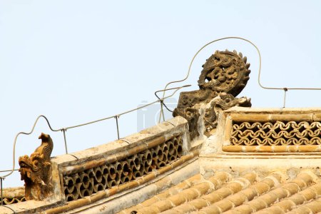 Photo for Temple eaves and beast sculpture, closeup of photo - Royalty Free Image