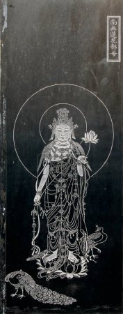 Foto de YUTIAN MAY 18Exquisite statues carved on the black marble in Jijue Temple on may 18, 2014, Yutian county, Hebei Province, China. - Imagen libre de derechos