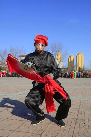 Photo for Luannan County - February 9, 2017: Chinese folk dance Yangko performance on the street, Luannan County, Hebei Province, China - Royalty Free Image