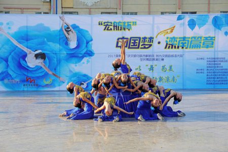 Photo for Luannan County - August 8, 2017: fitness dance competition in a park, Luannan County, Hebei Province, china - Royalty Free Image