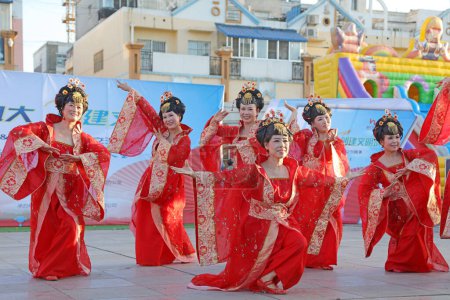 Photo for LUANNAN COUNTY, China - September 19, 2017: Sports dance performance in the outdoor square, LUANNAN COUNTY, Hebei Province, China - Royalty Free Image