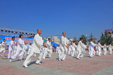 Photo for Luannan County - August 8, 2017: Taijiquan show in a park, Luannan County, Hebei Province, china - Royalty Free Image