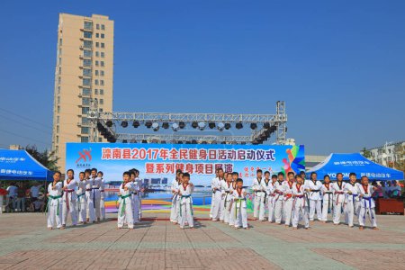 Photo for Luannan County - August 8, 2017:  Taekwondo show in a park, Luannan County, Hebei Province, china - Royalty Free Image