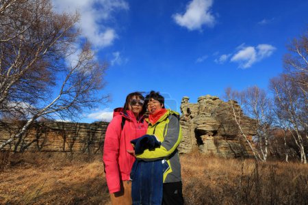Foto de Inner Mongolia, China - October 2, 2017: Tourists visit Ashhatu Stone Forest in Keshiketeng World Geopark, Inner Mongolia, China - Imagen libre de derechos