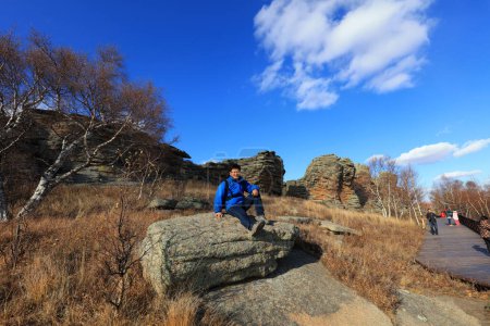 Foto de Inner Mongolia, China - October 2, 2017: Tourists visit Ashhatu Stone Forest in Keshiketeng World Geopark, Inner Mongolia, China - Imagen libre de derechos