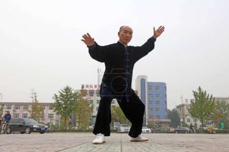 Photo for LUANNAN COUNTY, China - October 15, 2017: Taijiquan Exercise in the square, LUANNAN COUNTY, Hebei Province, China - Royalty Free Image