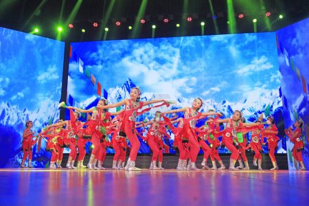 Foto de Luannan county - February 9, 2018: children dance performance on stage, luannan county, hebei province, China - Imagen libre de derechos