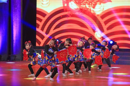 Luannan county - February 9, 2018: children dance performance on stage, luannan county, hebei province, China
