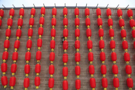 Photo for Red lantern on the wall closeup of photo - Royalty Free Image