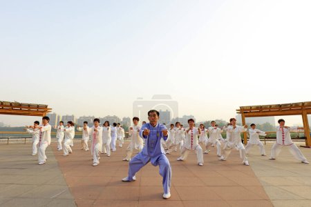 Photo for LUANNAN COUNTY, China - May 27, 2018: People practice Taijiquan in the park, LUANNAN COUNTY, Hebei Province, China - Royalty Free Image