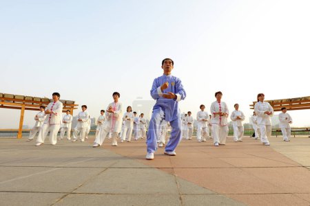 Photo for LUANNAN COUNTY, China - May 27, 2018: People practice Taijiquan in the park, LUANNAN COUNTY, Hebei Province, China - Royalty Free Image